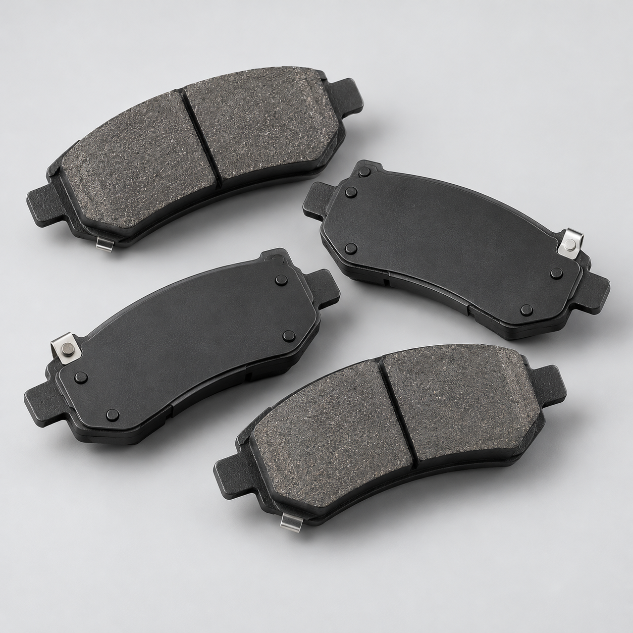 AI-created studio illustration of unbranded disc brake pads and friction surfaces